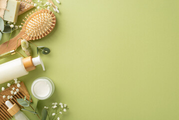 Earth-friendly self-care arrangement. Top view shot featuring jade roller, skincare essentials,...