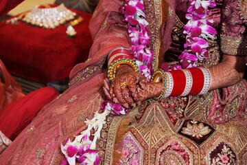 Indian bridal hands decorated with henna and jewelery