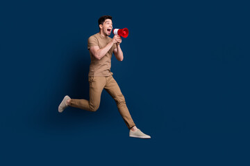 Full size photo of crazy man wear beige outfit running look at empty space sale screm in megaphone...