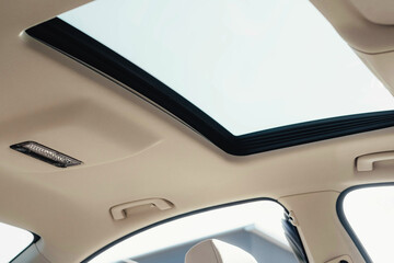 Interior of a business-class car, white perforated leather, aluminum, black lacquer, interior details.