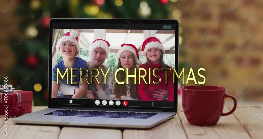 Wall mural Animation of merry christmas text over caucasian family on laptop screen and christmas decorations