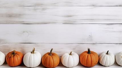 A group of pumpkins on a white color wood boards - obrazy, fototapety, plakaty