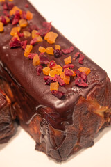 Chocolate bread with candied fruits on a supermarket display.