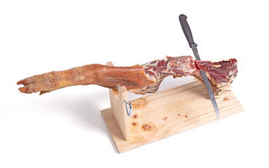Leg of spanish jamon serrano, dry cured ham, on a white background