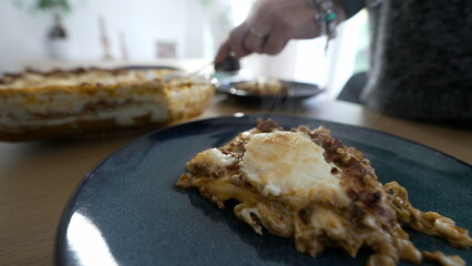 Closeup of lasagna meal on plate, serving Italian dish for family lunch. culinary carb food