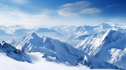 Panoramic view of snowy mountains and blue sky with white clouds