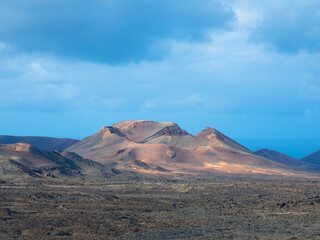 Spectacular views of the Fire Mountains at Timanfaya National Park, this unique area consisting entirely of volcanic soils. A Mars-like volcanic landscape in a sea of ​​lava. Lanzarote, Canary Island