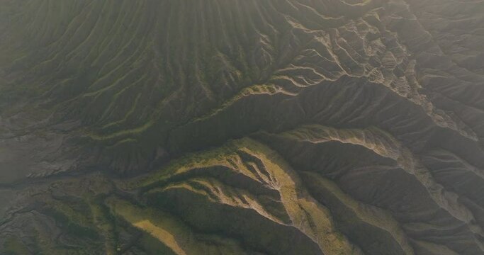Aerial Top Forward Full Frame Of Pattered Mountain On Sunny Day - Java, Indonesia