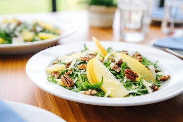 chopped pecans sprinkled on pear and cheese salad - obrazy, fototapety, plakaty