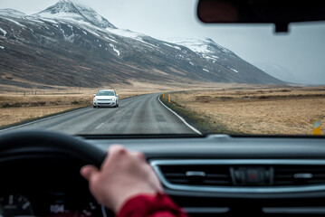 Driving car through volcanic Iceland landscape