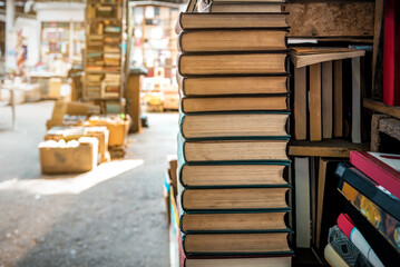 Stacks of different old books at the street book fair market