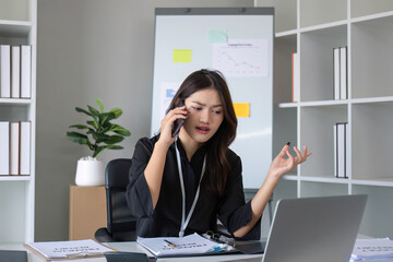 Obraz premium Happy asian business woman have the joy of talking on the smartphone, tablet and laptop on the modern office