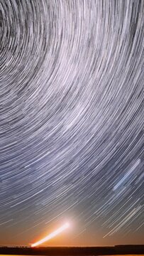 Spin Of Stars In Sky. Stars Rotate Of Sky Background. Track Trails. Spin Trails Of Stars. Large Exposure. Amazing Stars Effects In Sky. Star Trails On Night Sky Background. Time Lapse, Timelapse, Time