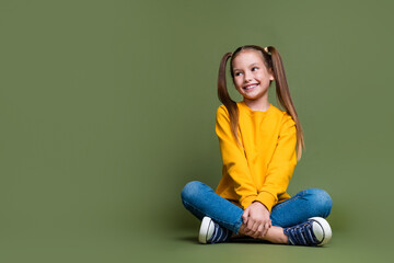 Full size photo of cute little schoolgirl with ponytails wear yellow pullover look at sale empty...