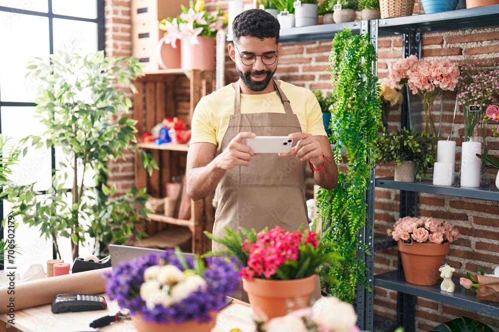 Sticker young arab man florist make photo to plant by smartphone at florist