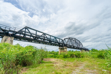 Beautiful scenic of black steel railway bridge across the river