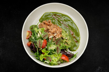 Salmon tartar with avocado and mixed greens