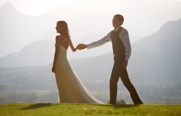 Couple holding hands, bride and groom at wedding, outdoor in nature for social event with love and...