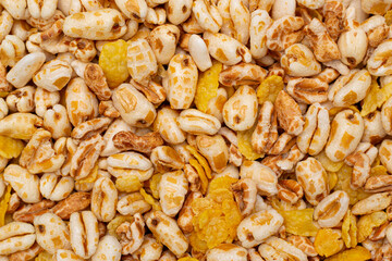 Background and texture of wheat flakes and puffed corn.