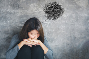 concept of depressive disorder Asian woman sitting alone with negative thoughts during depression