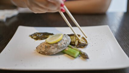Young woman's delight, hear her crave the fresh abalone she eats at her favorite seafood restaurant - dive into this delicious sea delicacy