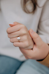 hand with a bridal ring, heart proposal, ring with a large diamond stone