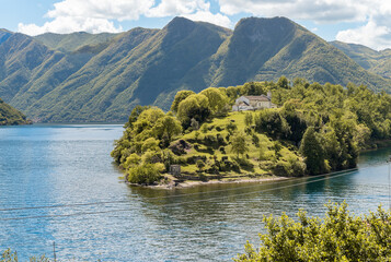 View of the Comacina Island with Saint Giovanni church on lake Como, Ossuccio, Lombardy, Italy
