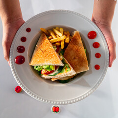 person holding a sandwich