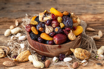 Nuts and dried fruit mix, healthy and wholesome food. Symbols of judaic holiday Tu Bishvat.