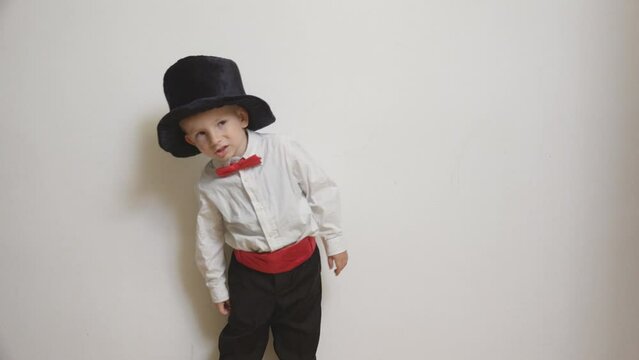 Little boy with big carnival magician hat