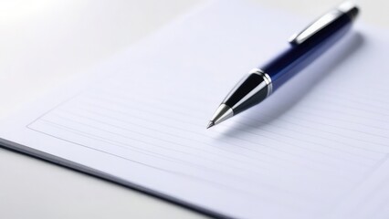 Blue pen on white notepad, educational supplies, pen for business, school and office, on white insulated background