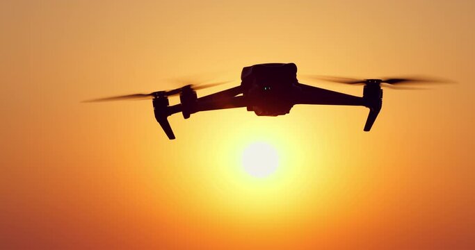 Sun rising over sea horizon, flying drone toward sunlight of sun over water video
