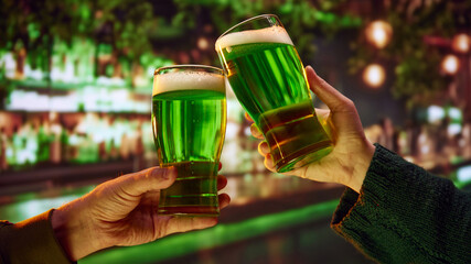 Two people sitting in pub at bar counter and drinking craft green traditional beer, cider....