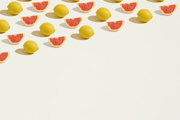 A seamless pattern made of isolated sliced grapefruits and lemons