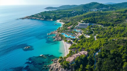 Fototapeta na wymiar Aerial View of Luxury Resort by Turquoise Sea Surrounded by Lush Greenery on a Sunny Coastal Landscape