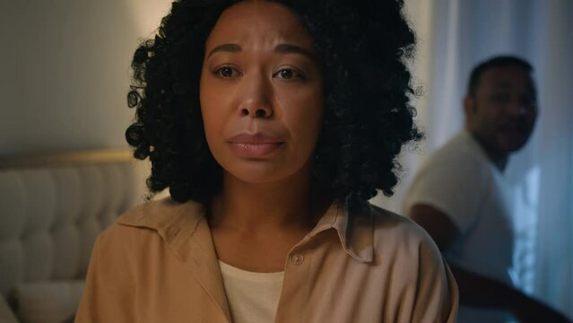 African American angry man yelling accusing blame woman of infidelity violence scandal drama shouting loudly in bedroom at night bed girlfriend suffer listen accusations conflict couple family crisis