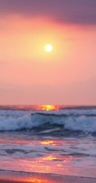 Color sunrise over ripple waves and sea horizon vertical landscape video