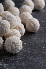 Photography of a tasty of homemade coconut candies. This delectable and visually appealing snack offers a variety of flavors. Each candy is an object of desire, creating a sweet temptation
