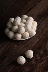 Photography of a sweet delight featuring coconut, This homemade dessert is a tempting treat, capturing the essence of a delightful snack. Isolated on a background,