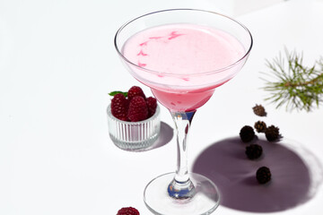 A creamy raspberry margarita cocktail with a swirl of pink and red hues, ready for a refreshing sip.