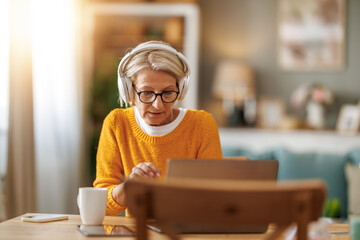Elderly woman working from home office