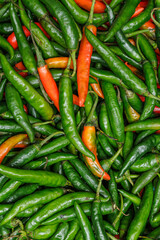 Harvest green and red chilies. Green and red chilies in traditional market. Green and red chilies fullframe.