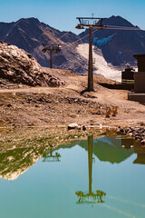 High resolution stitched alpine summer panorama with reflections in a lake at Wildspitzbahn cable car, Pitztal Glacier, Imst, Tyrol, Austria