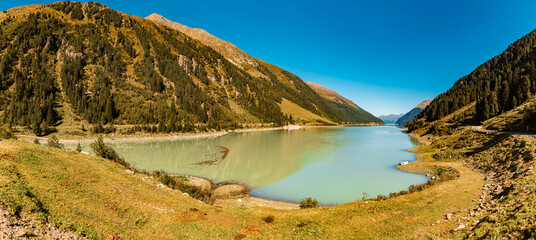 High resolution stitched alpine summer panorama with reflections at the famous Gepatsch Reservoir, Kaunertal Glacier Road, Kaunertal valley, Landeck, Tyrol, Austria