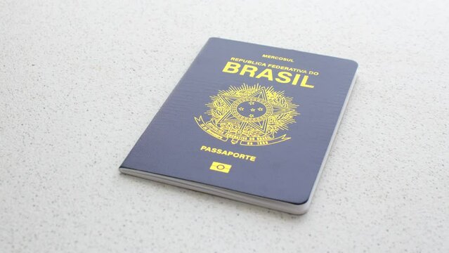 Close-up of the Brazilian passport against a white background, symbolizing travel and citizenship. Clear image of a Brazilian passport on a white background, emphasizing authenticity and simplicity.