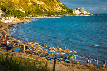 currilave beach shoreline with hotels in Durres, Albania during sunset