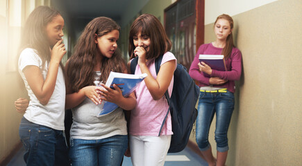 Girls, school and bullying student in gossip, secret or whisper down the corridor or hallway. Group of young kids or children teasing and laughing by lonely learner in verbal abuse outside classroom - obrazy, fototapety, plakaty