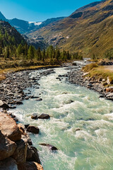 Alpine summer view with a mountain stream at the famous Kaunertal Glacier Road, Kaunertal valley, Landeck, Tyrol, Austria