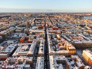 Fototapete Rund Aerial panoramic view of the district of Sodermalm in Stockholm, Sweden, in winter with snow on the roofs and morning sun. © John