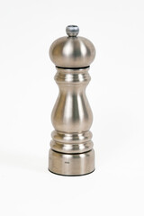 An isolated brushed stainless steel pepper grinder 